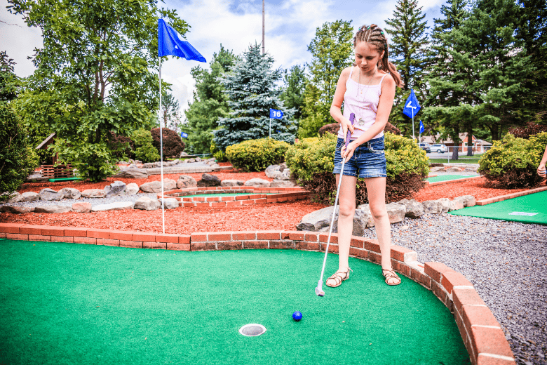 Girl Putting at Alpine Mini Golf Village