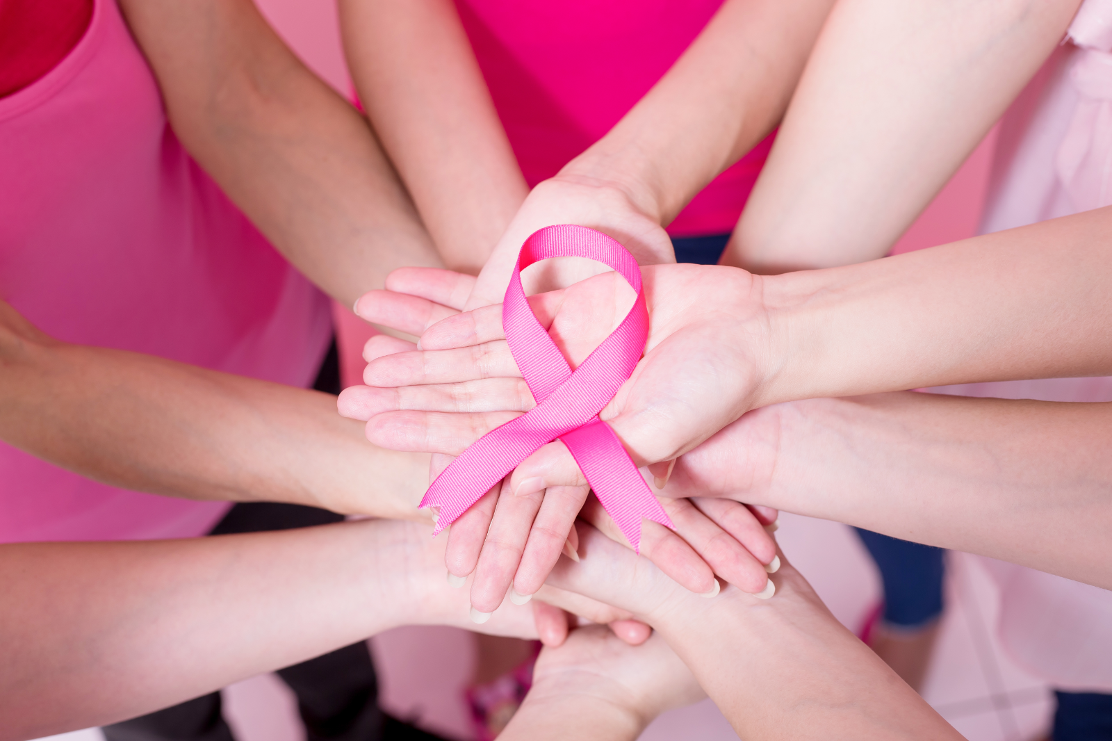 Hands holding Breast Cancer Ribbon