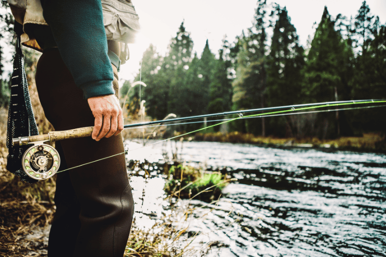 Person Holding Fishing Rod