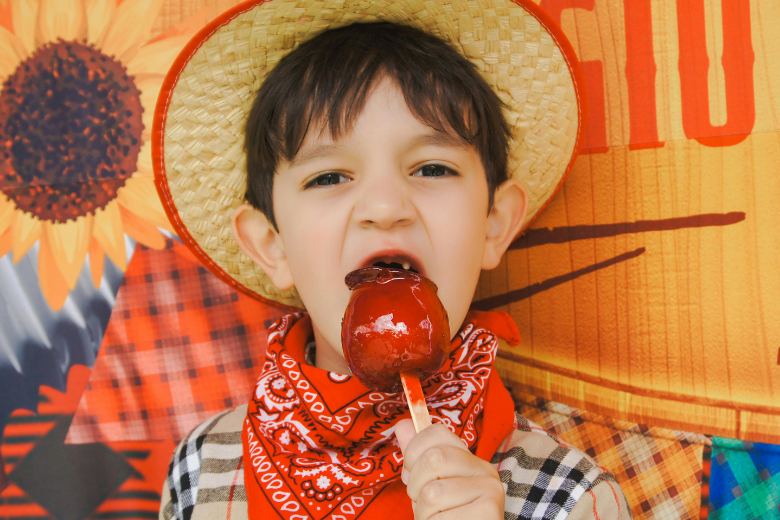 Child Eating Candy Apple