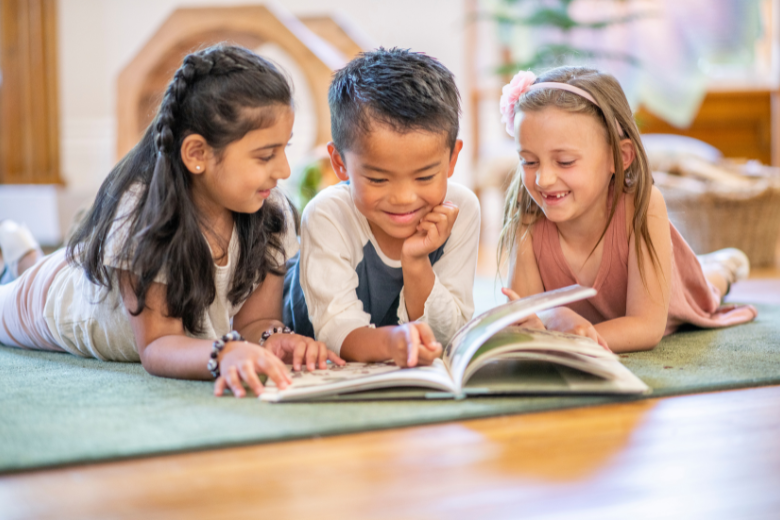 Kids Reading a Book Together at Library