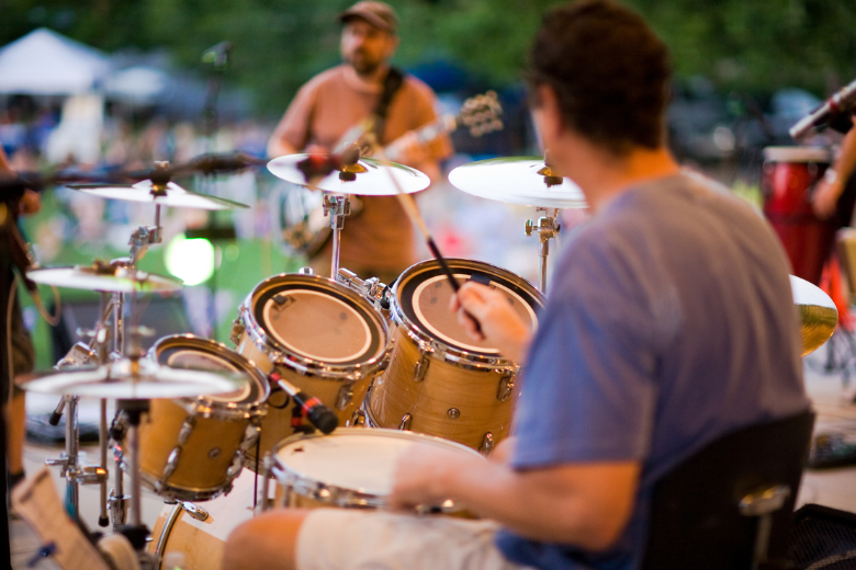 Person Playing the Drums